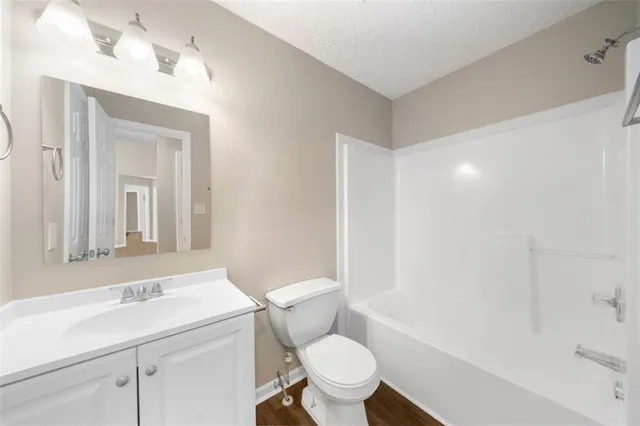 a bedroom with a large bed and a large window