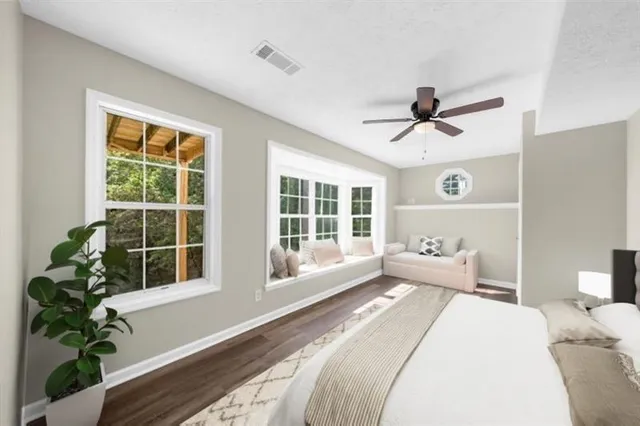 a view of a backyard with sitting area