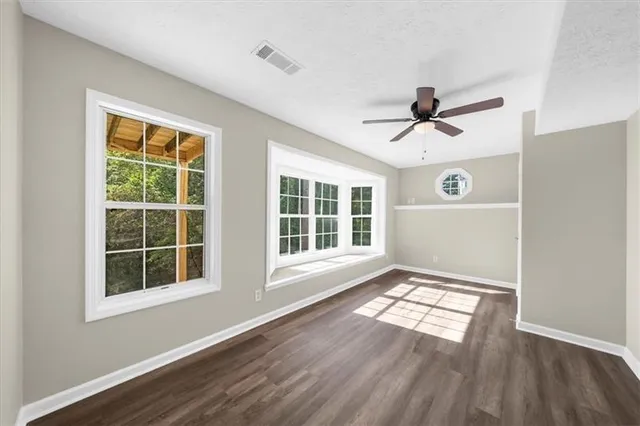 an aerial view of a house with outdoor space