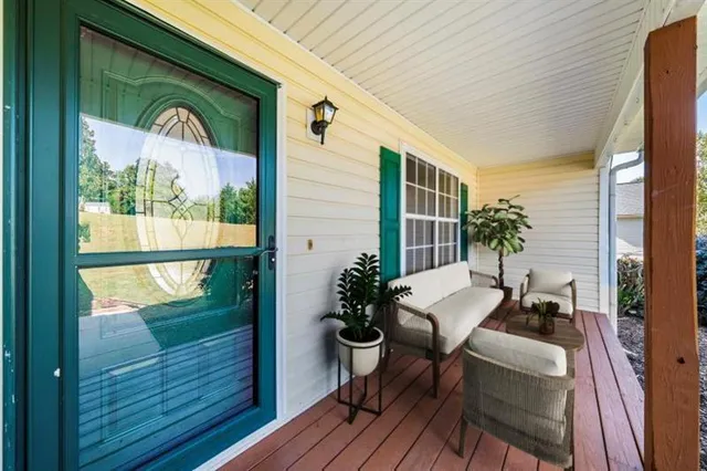 a living room with furniture fireplace and flat screen tv