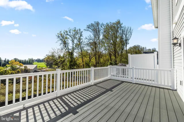 a view of deck with wooden floor and fence