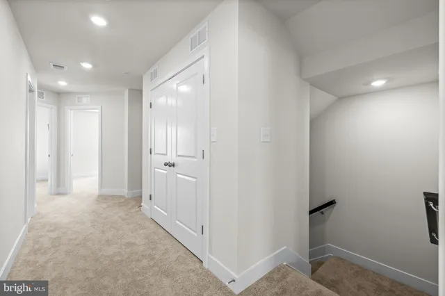 a view of a hallway with closet