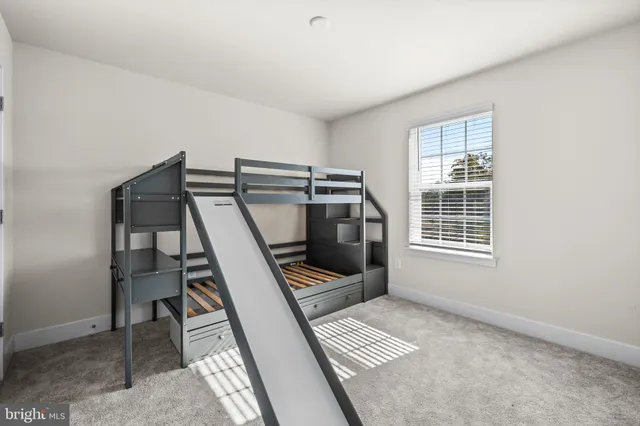 a bathroom with a granite countertop sink a toilet and bathtub