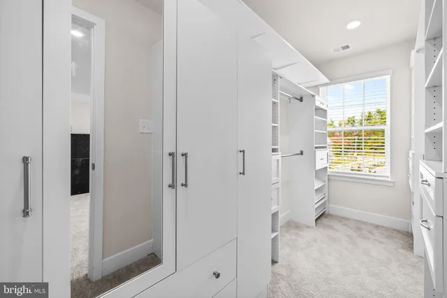 a bathroom with a shower sink and mirror