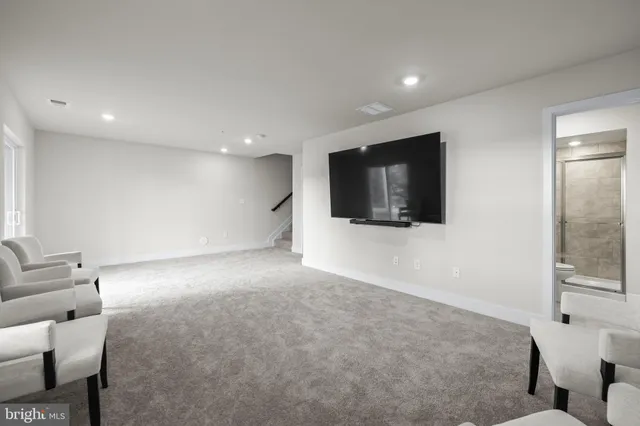 a backyard of a house with plants and large garden