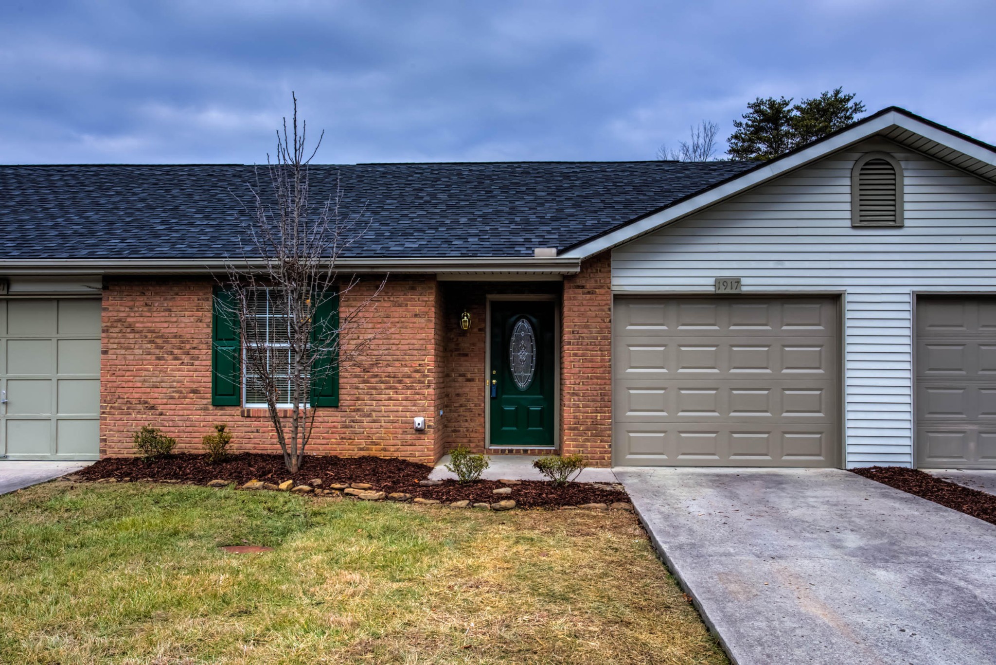 1917 Wellbridge Way Powell, TN 37849 - Photo 1 of 19 a front view of a house with garden