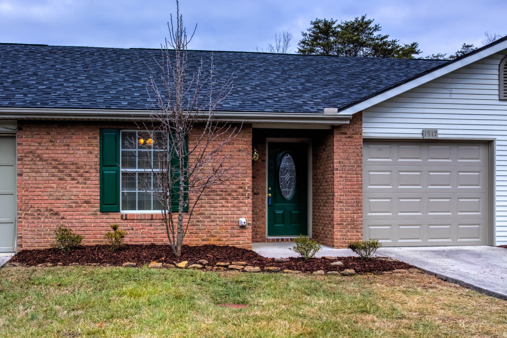 1917 Wellbridge Way Powell, TN 37849 - Photo 2 of 19 a front view of a house with a yard