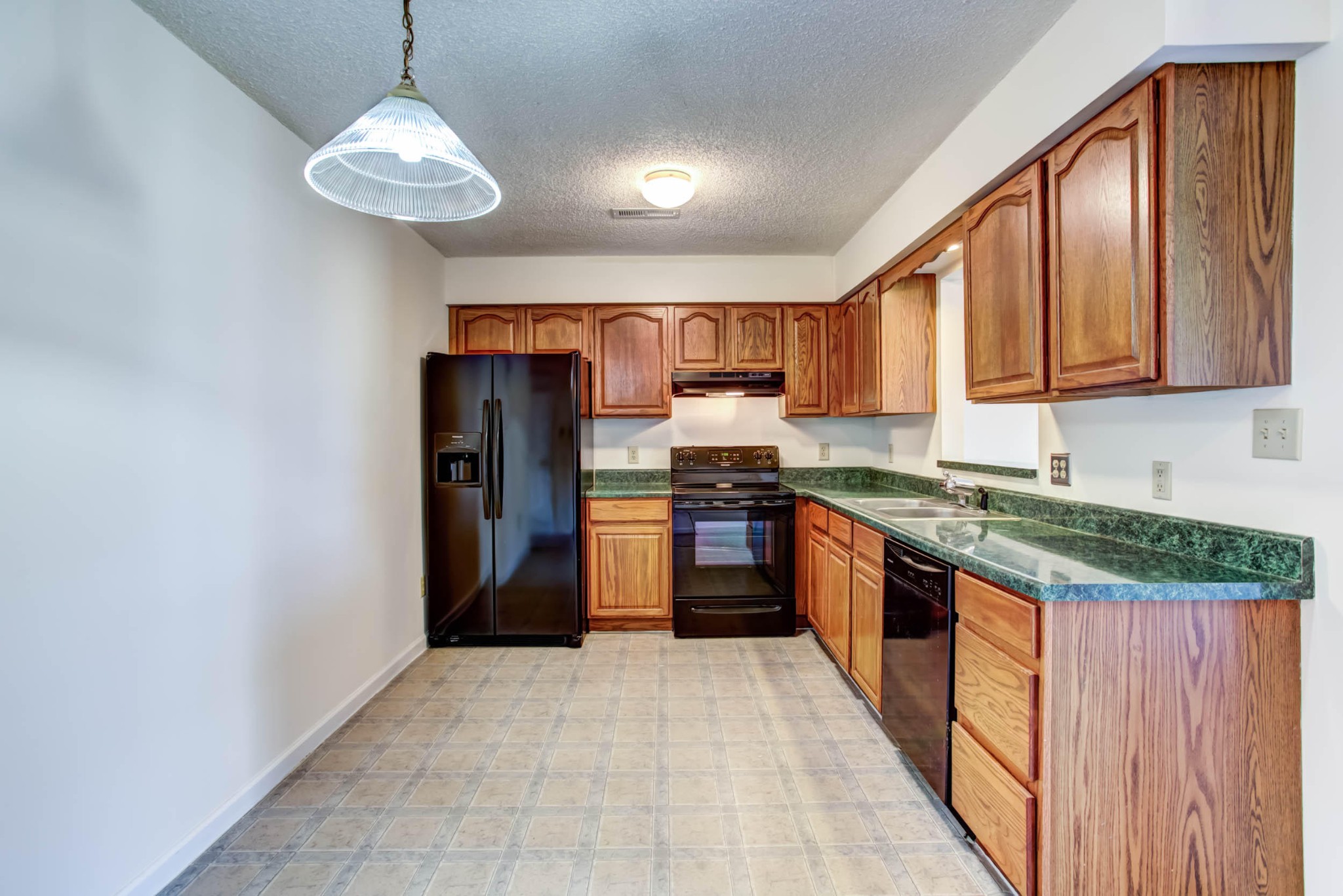 1917 Wellbridge Way Powell, TN 37849 - Photo 8 of 19 a kitchen with stainless steel appliances granite countertop a refrigerator a sink dishwasher a stove with wooden cabinets and floor