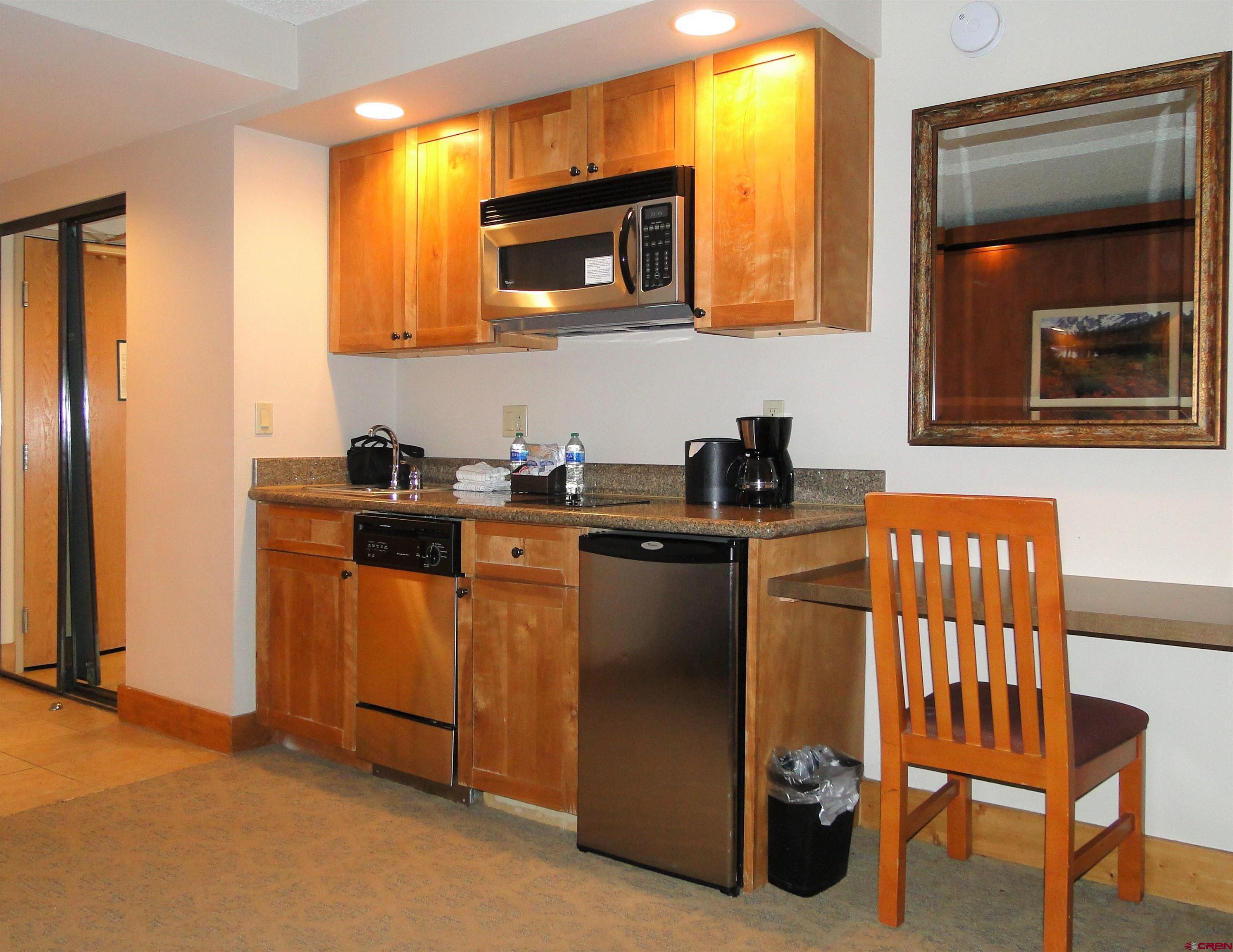 6 Emmons Road, Unit 122 Crested Butte, CO 81225 - Photo 13 of 19 a kitchen with a sink cabinets and microwave