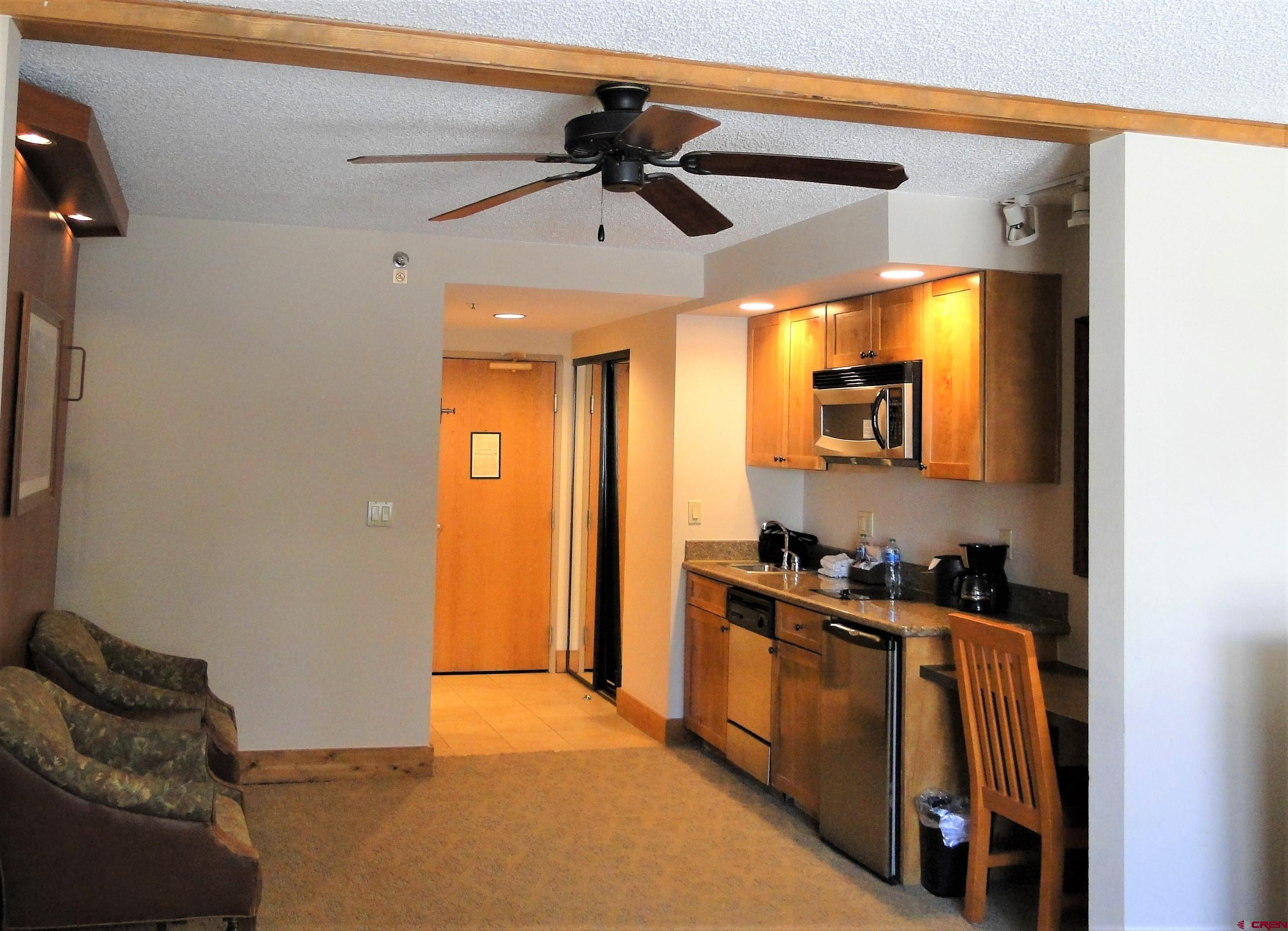 6 Emmons Road, Unit 122 Crested Butte, CO 81225 - Photo 15 of 19 a kitchen with stainless steel appliances granite countertop a refrigerator and a stove