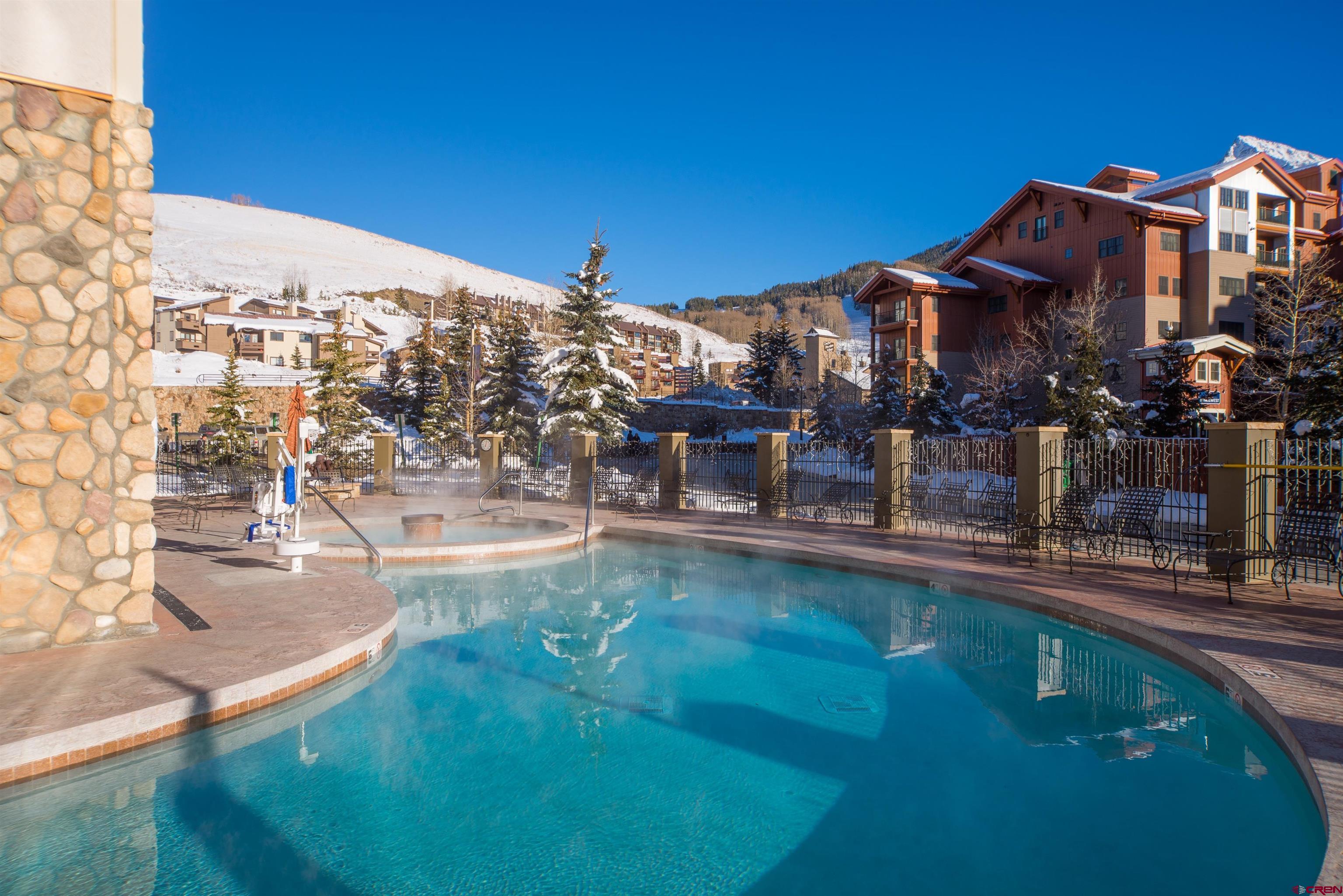 6 Emmons Road, Unit 122 Crested Butte, CO 81225 - Photo 8 of 19 a swimming pool view with a outdoor space