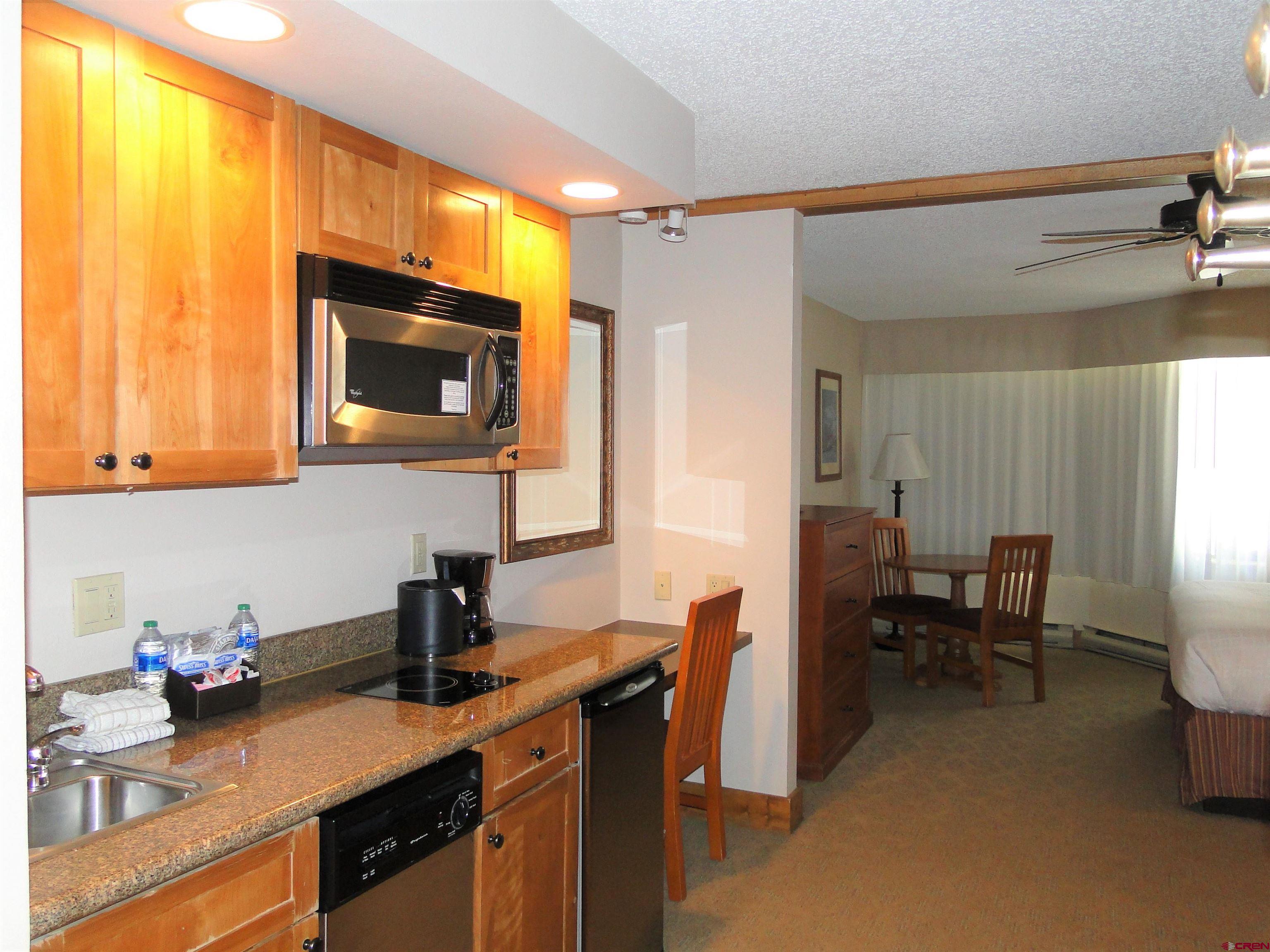 6 Emmons Road, Unit 122 Crested Butte, CO 81225 - Photo 10 of 19 a kitchen with a sink cabinets and appliances
