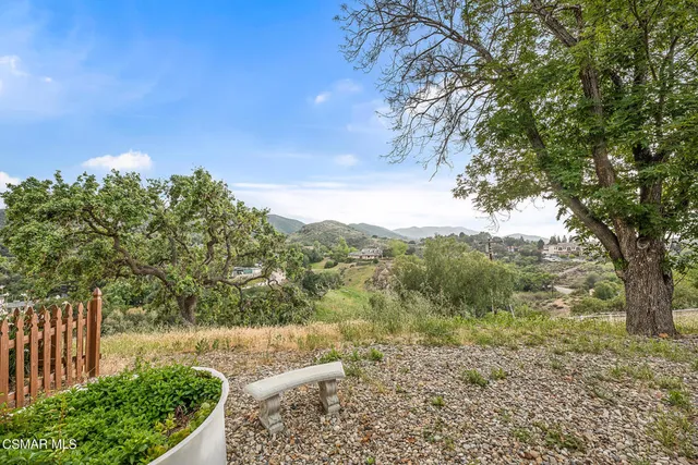a view of a yard with an outdoor space