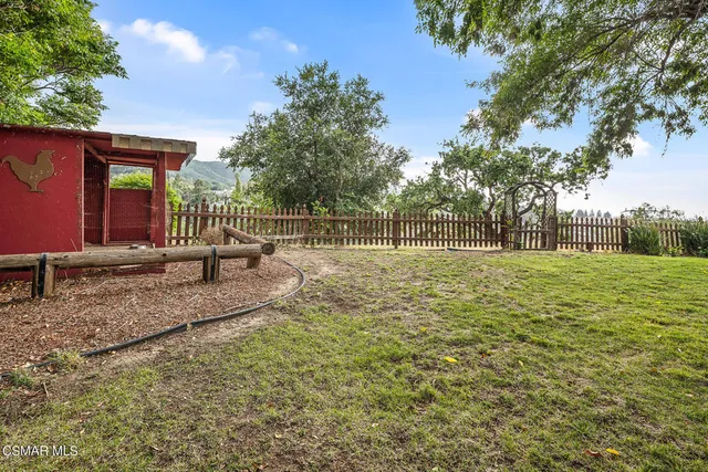 a kitchen with a sink and a large window