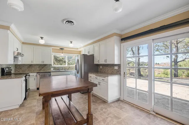 an aerial view of residential house with outdoor space