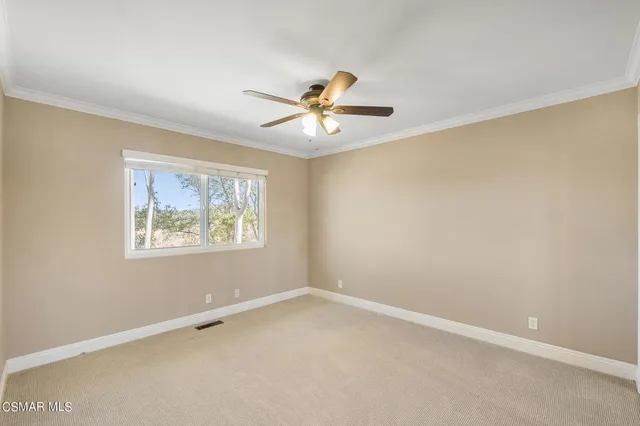 a front view of a house with a yard table and chairs
