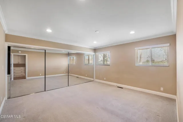 a view of a house with a snow on the road