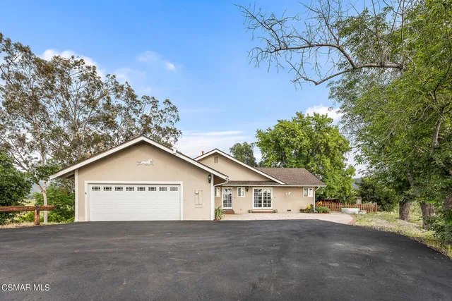 a view of a backyard of a house