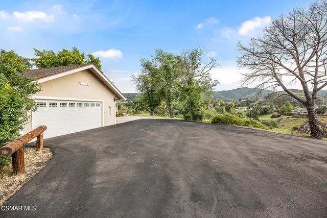 a view of a backyard with garden