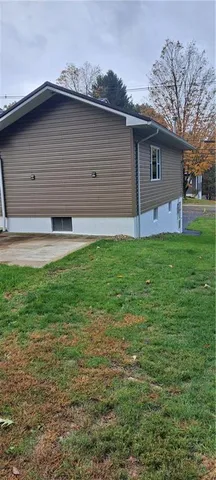 a backyard of a house with lots of green space