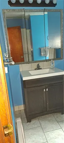 a bathroom with a sink and a mirror