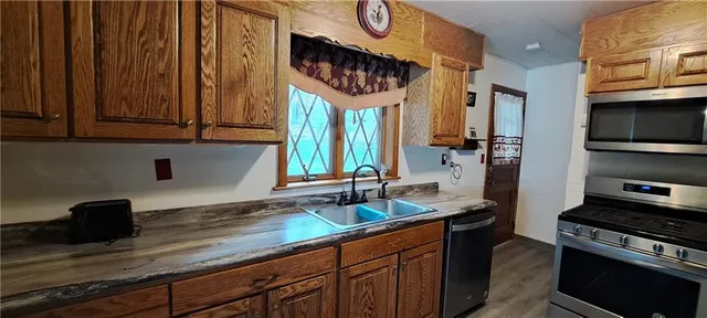 a kitchen with a sink and cabinets