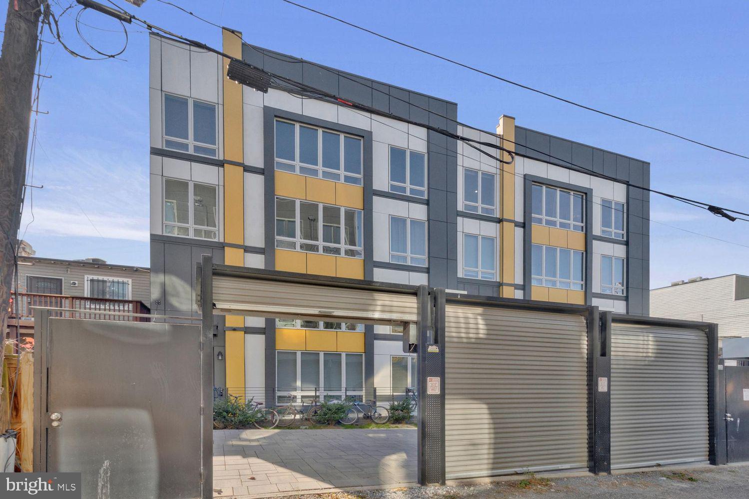 1654 K Street Northeast, Unit 8 Washington, DC 20002 - Photo 17 of 20 a front view of a building with a glass door