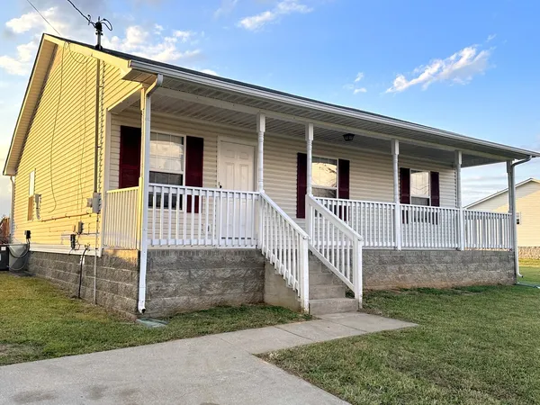front view of a house with a yard