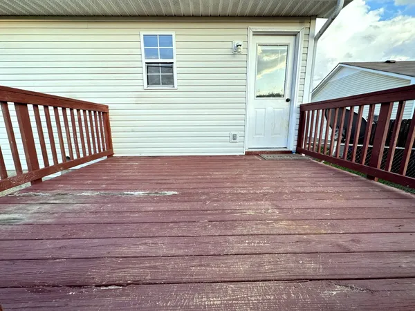 a view of a backyard with a deck