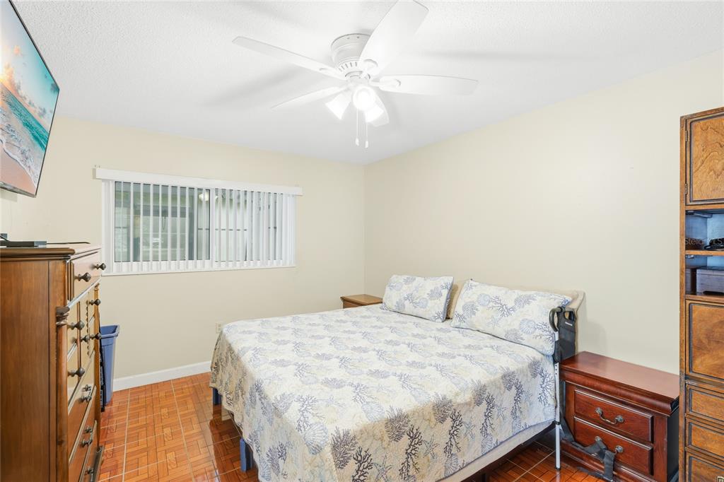 6067 Arlene Way, Unit 5 Bradenton, FL 34207 - Photo 11 of 25 a bedroom with a bed and a window