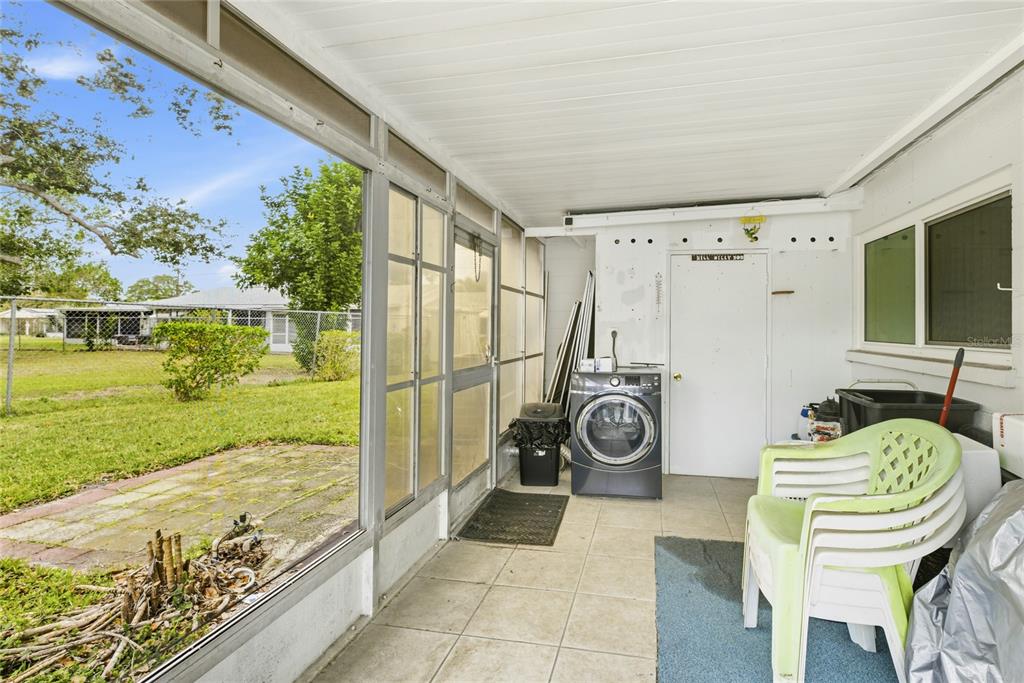 6067 Arlene Way, Unit 5 Bradenton, FL 34207 - Photo 17 of 25 a view of a chairs and table in patio