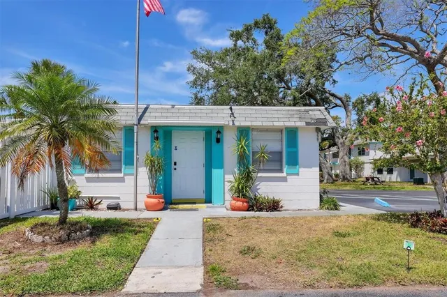 swimming pool view with a seating space and garden view