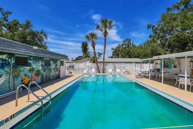 a view of a backyard with a deck and a patio