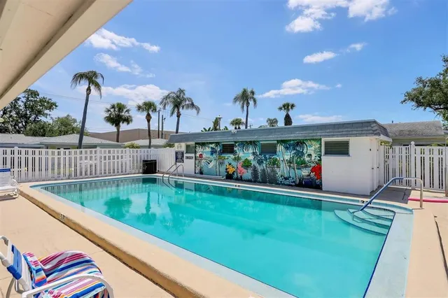 a view of a swimming pool with a patio