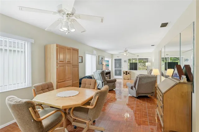 a dining room with furniture and window