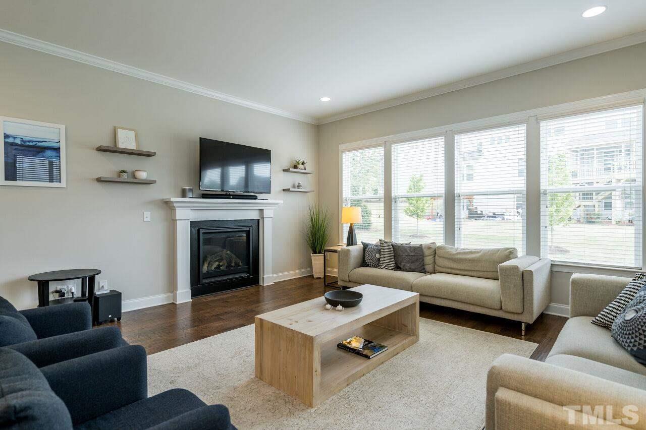 5264 Aleppo Lane Raleigh, NC 27613 - Photo 11 of 30 Spacious living room with gas fireplace and plenty of room for board games, tv nights and hanging.