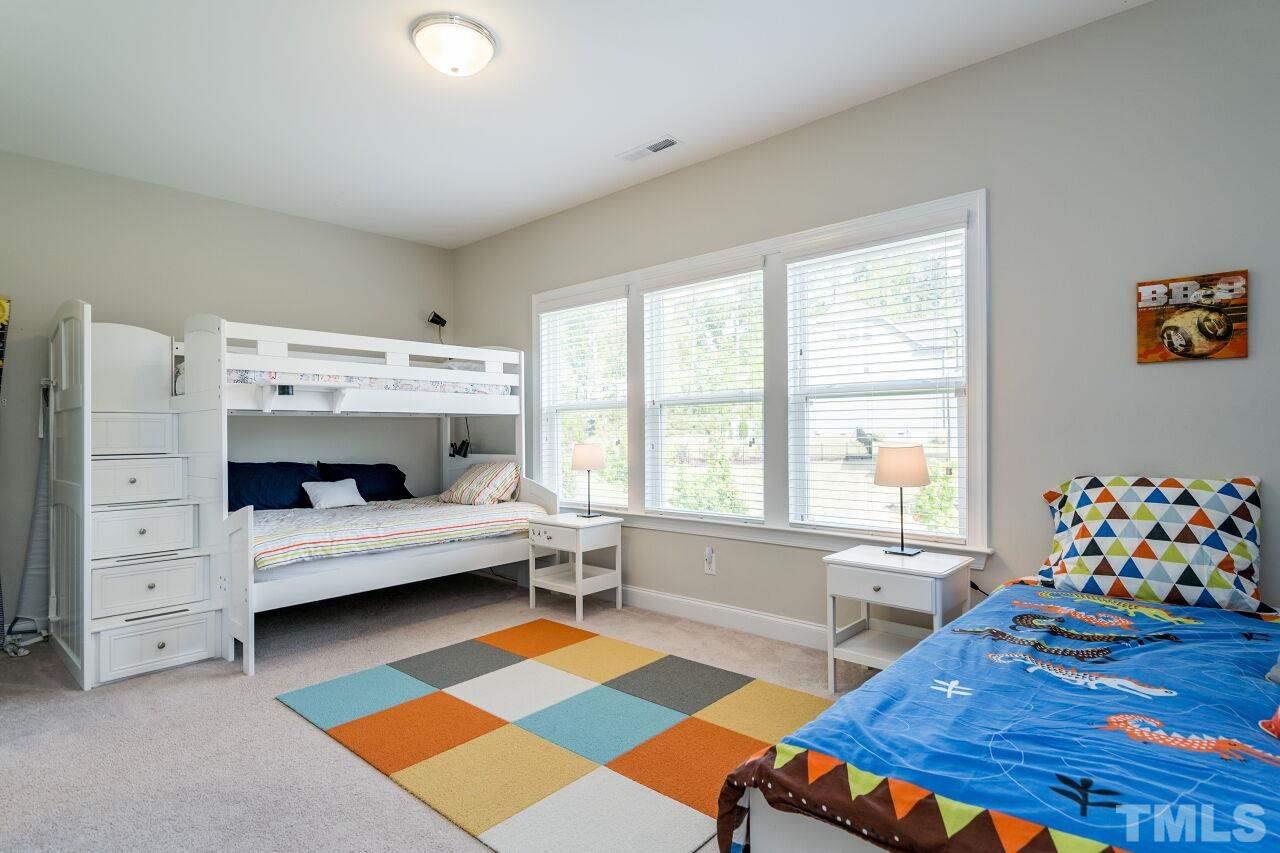 5264 Aleppo Lane Raleigh, NC 27613 - Photo 23 of 30 Upstairs secondary bedroom with an en suite bath.
