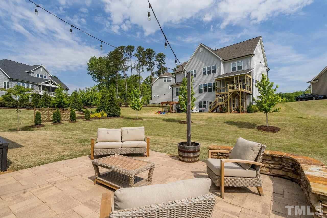 5264 Aleppo Lane Raleigh, NC 27613 - Photo 28 of 30 Paver patio out back expands your outdoor living space.
