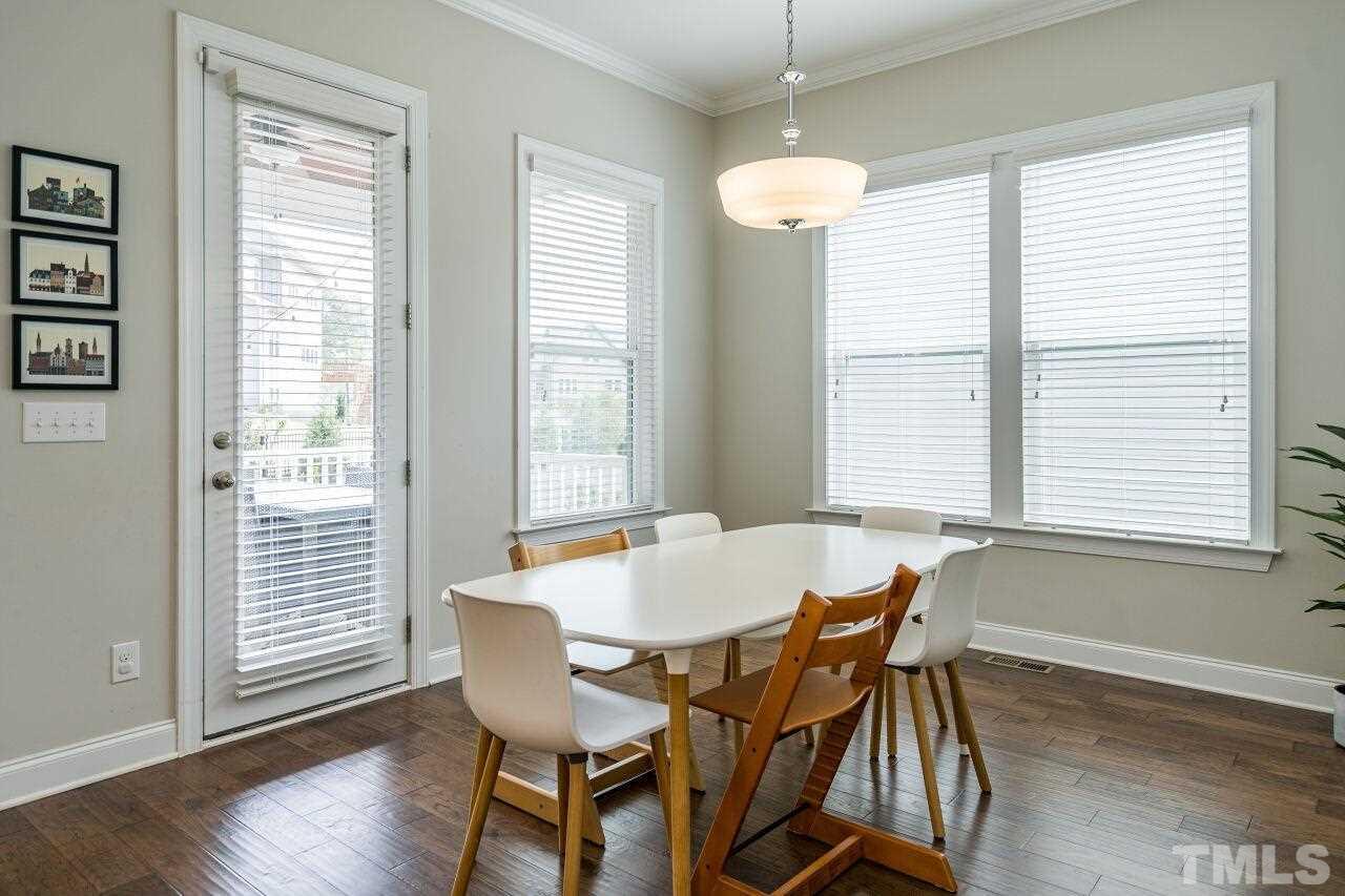 5264 Aleppo Lane Raleigh, NC 27613 - Photo 10 of 30 Open and sunny breakfast nook that leads out to the covered porch.