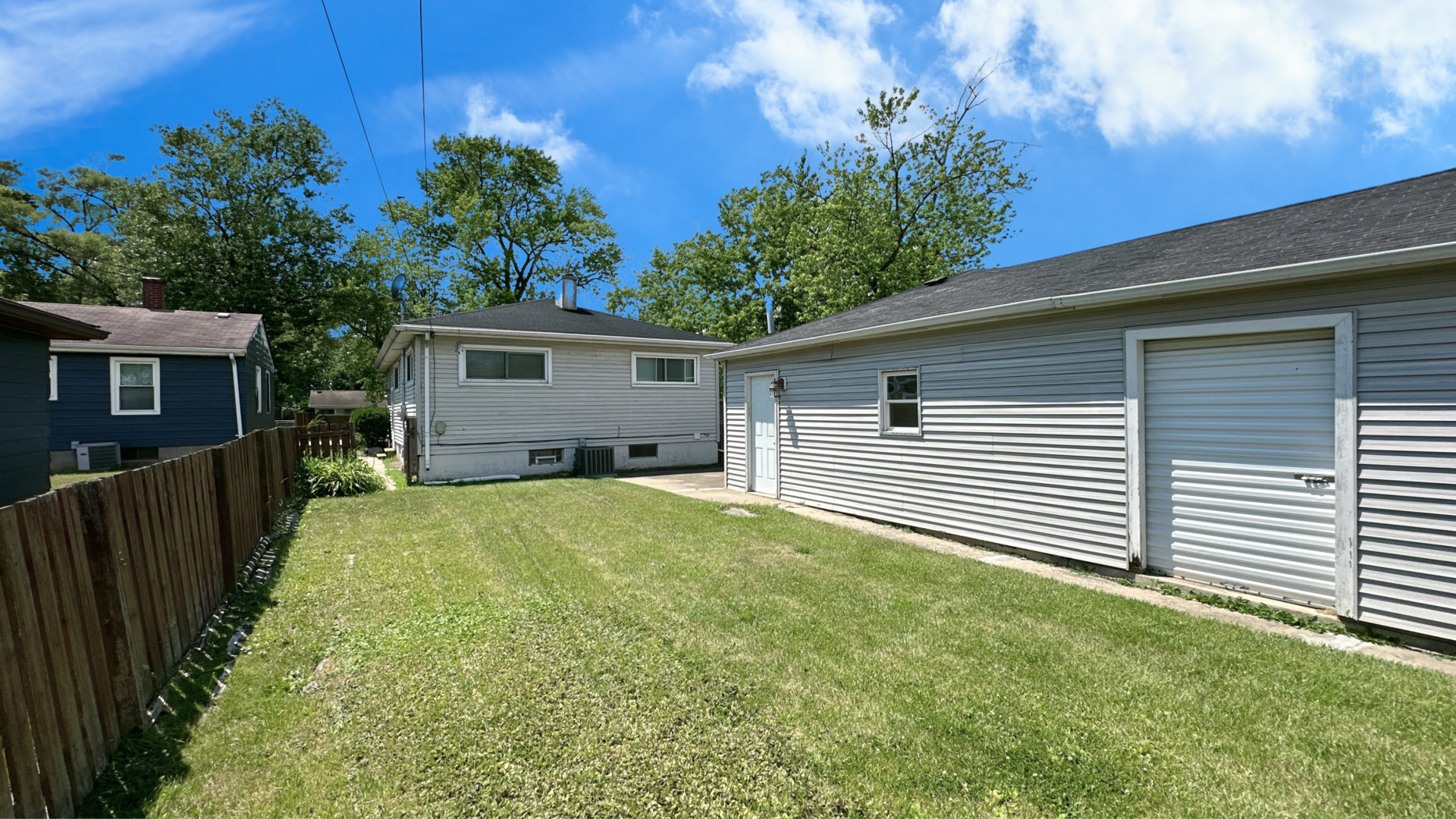 17303 Roy Street Lansing, IL 60438 - Photo 20 of 23 a view of a backyard with plants and a patio