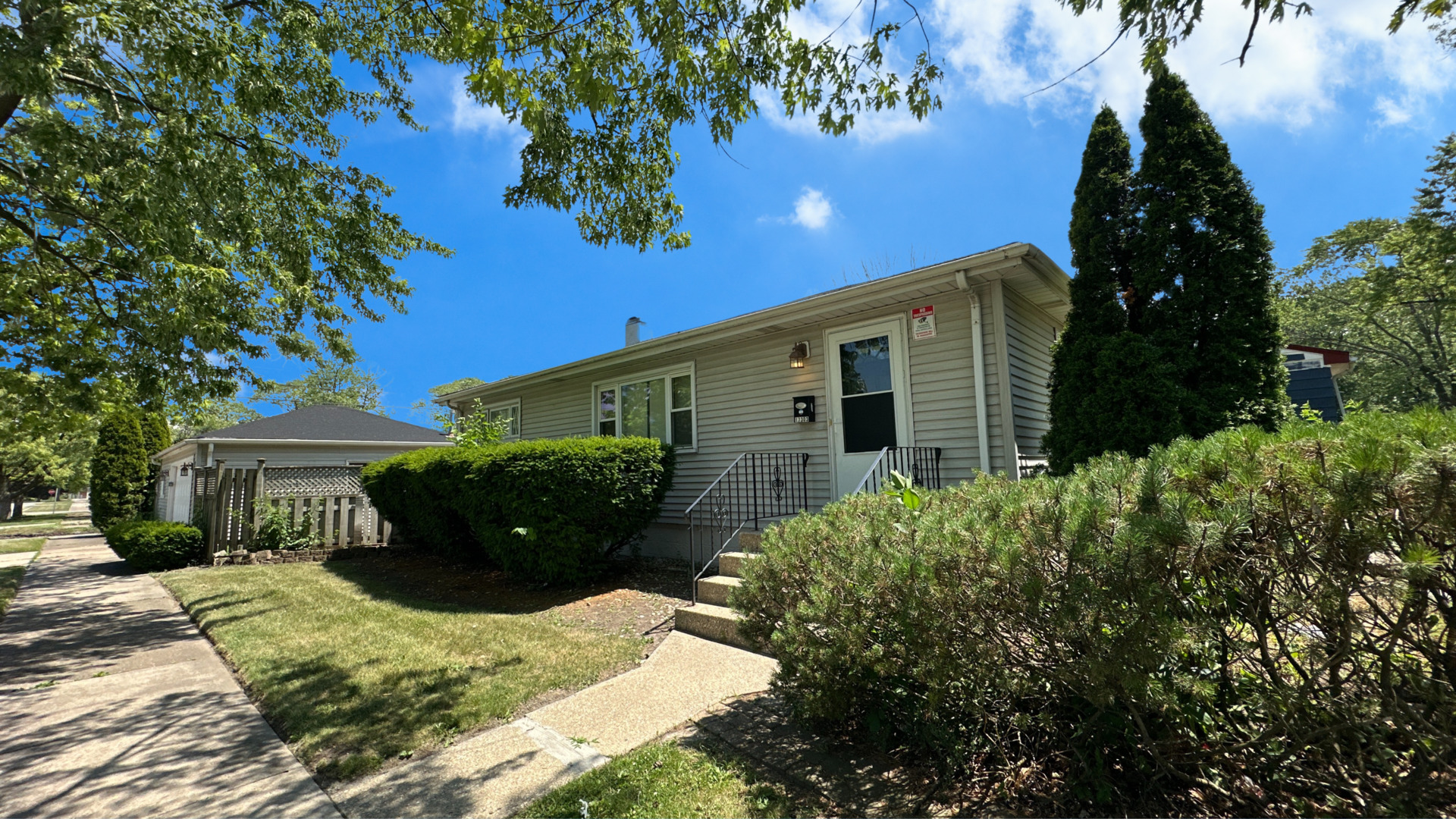 17303 Roy Street Lansing, IL 60438 - Photo 2 of 23 front view of a house with a yard