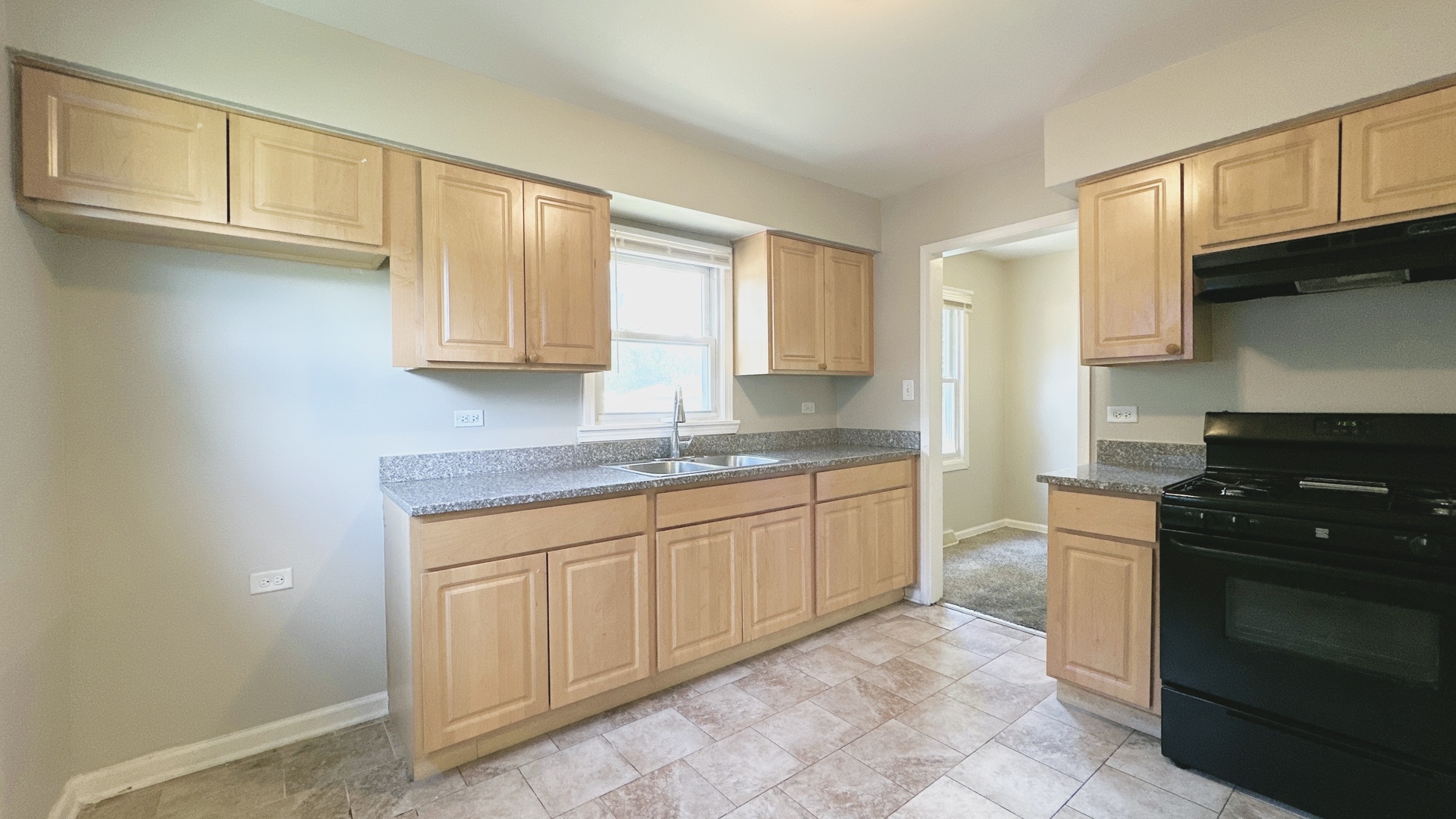 17303 Roy Street Lansing, IL 60438 - Photo 6 of 23 a kitchen with granite countertop cabinets stainless steel appliances and a sink