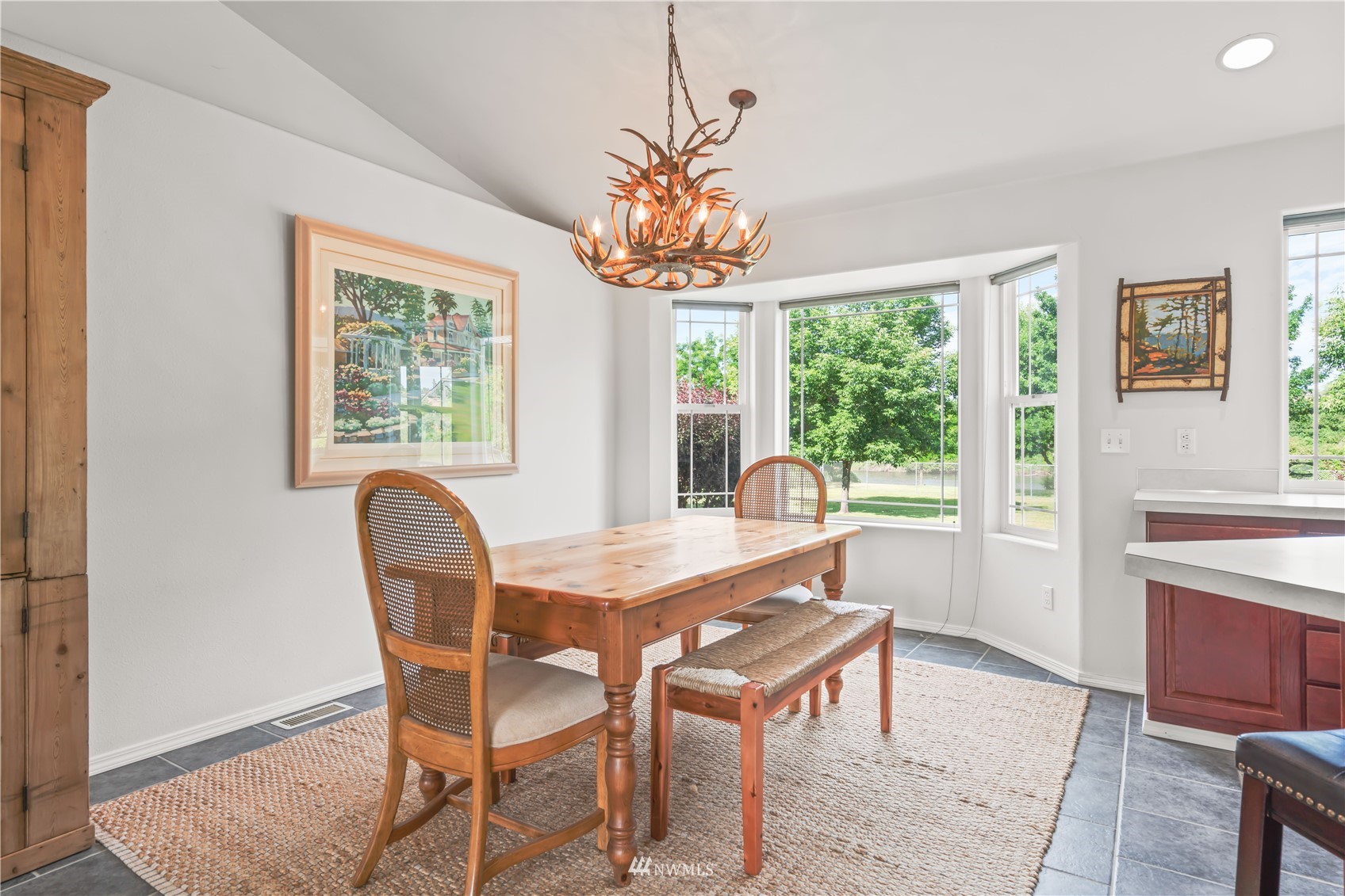 250 Rivers Edge Lane Yakima, WA 98901 - Photo 5 of 40 a view of a dining room with furniture a chandelier and wooden floor