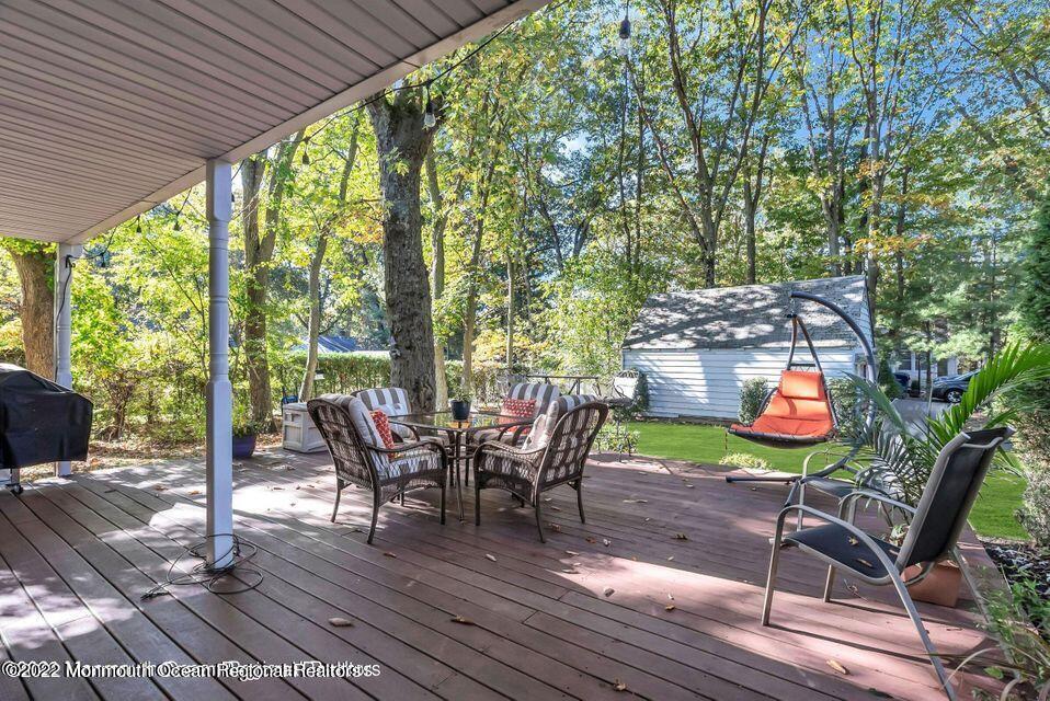 96 Whalepond Road Oakhurst, NJ 07755 - Photo 2 of 3 a view of a chairs and table in the patio
