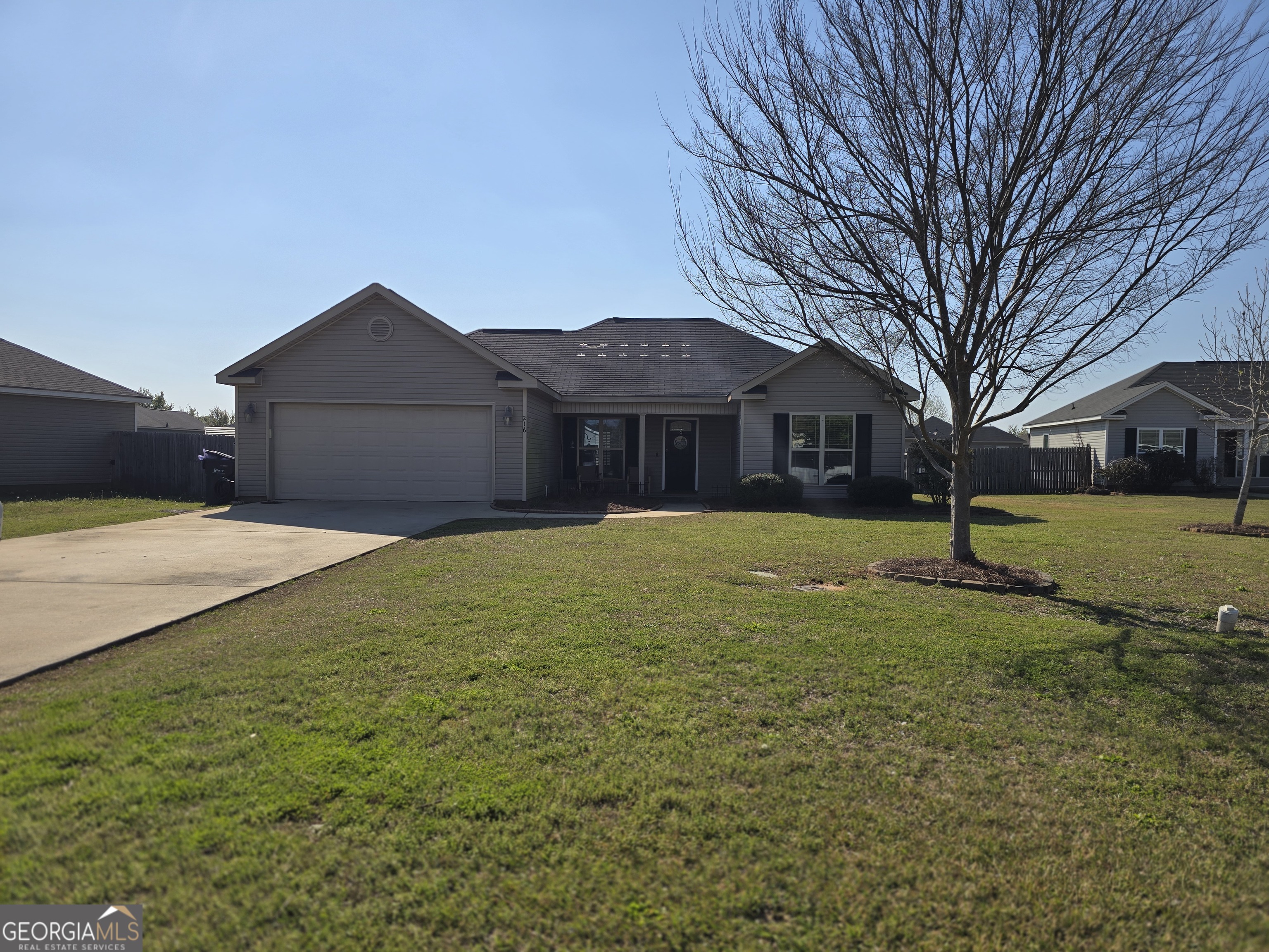 216 Winsted Court Perry, GA 31069 - Photo 1 of 1 a front view of a house with a yard