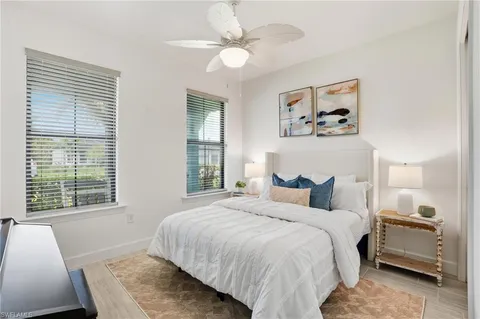 a view of a room with wooden floor and white walls