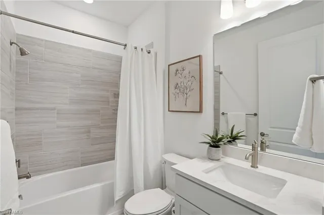 a bedroom with a bed and a lamp