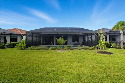 a view of a backyard with sitting area