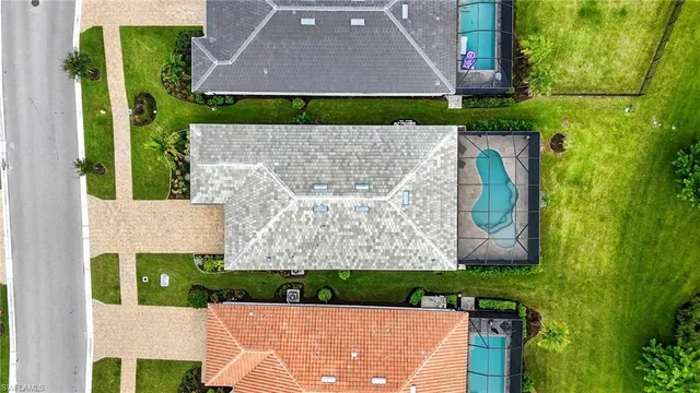 a front view of a house with a yard table and chairs