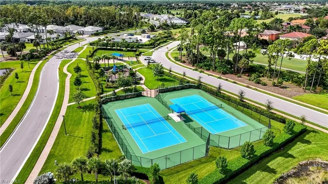 an aerial view of a houses with a swimming pool